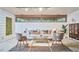 Chic living room with concrete block walls, and designer furniture and accessories at 220 Glenhill Ln, Chapel Hill, NC 27514