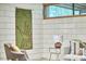 View of living room corner showcasing textured wall and contemporary furnishings at 220 Glenhill Ln, Chapel Hill, NC 27514