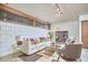 Stylish living room features concrete block walls, ample natural light and comfortable seating at 220 Glenhill Ln, Chapel Hill, NC 27514