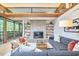 Living room showcasing a stone fireplace, built-in shelves, and comfortable seating with natural light at 220 Glenhill Ln, Chapel Hill, NC 27514