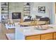 Open-concept living area features a dining area, fireplace, and sleek kitchen island with bright countertops at 220 Glenhill Ln, Chapel Hill, NC 27514