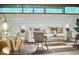 Inviting living room area with a comfortable sofa, accent chairs, and a contemporary glass coffee table at 220 Glenhill Ln, Chapel Hill, NC 27514