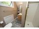 Cozy bathroom includes a tile floor, single vanity, medicine cabinet and a tiled shower stall at 221 Ironwoods Dr, Chapel Hill, NC 27516