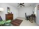 Cozy bedroom featuring a ceiling fan, vintage dresser, and neutral walls at 221 Ironwoods Dr, Chapel Hill, NC 27516
