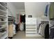 Walk-in closet with built-in shelves, drawers, and clothing rods offers ample storage space at 221 Ironwoods Dr, Chapel Hill, NC 27516