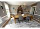 Traditional dining room with a wooden table, six chairs, and stylish light fixture at 221 Ironwoods Dr, Chapel Hill, NC 27516