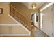 Welcoming foyer with hardwood floors, staircase, and decorative lighting at 221 Ironwoods Dr, Chapel Hill, NC 27516