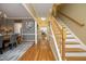 Open hallway with hardwood floors and views of the dining room and living spaces at 221 Ironwoods Dr, Chapel Hill, NC 27516