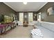 Comfortable living room featuring hardwood floors, wainscoting, and windows with natural light at 221 Ironwoods Dr, Chapel Hill, NC 27516