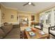 Spacious living room with hardwood floors, fireplace, and open access to the kitchen and patio at 221 Ironwoods Dr, Chapel Hill, NC 27516