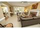 Comfortable living room with a fireplace, french doors, and views into the dining area at 221 Ironwoods Dr, Chapel Hill, NC 27516