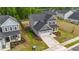 Aerial view of home, fenced yard, manicured landscaping, and convenient two-car garage at 2215 Montebell View Dr, Fuquay Varina, NC 27526