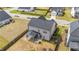 Aerial view of the home, highlighting a screened in back porch and fenced in backyard at 2215 Montebell View Dr, Fuquay Varina, NC 27526