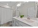 Bright bathroom with double sinks, large mirror, and shower-tub combination at 2215 Montebell View Dr, Fuquay Varina, NC 27526