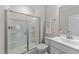 Clean bathroom featuring a glass-enclosed shower, tile floors, and modern vanity at 2215 Montebell View Dr, Fuquay Varina, NC 27526