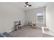 Cozy bedroom with a play kitchen, seating area, and ample natural light at 2215 Montebell View Dr, Fuquay Varina, NC 27526