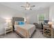 Cozy bedroom features neutral walls, ceiling fan, plush carpeting and a study area at 2215 Montebell View Dr, Fuquay Varina, NC 27526