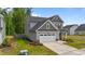 Charming two-story home featuring a two-car garage, landscaped yard, and modern design at 2215 Montebell View Dr, Fuquay Varina, NC 27526