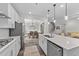 Contemporary kitchen featuring a large island, stainless steel appliances, and open floor plan at 2215 Montebell View Dr, Fuquay Varina, NC 27526