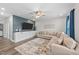 Inviting living room features custom built-ins, a large sectional sofa, and stylish decor at 2215 Montebell View Dr, Fuquay Varina, NC 27526