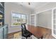 Home office features natural light, neutral paint and wood floors at 2215 Montebell View Dr, Fuquay Varina, NC 27526