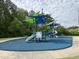 Community playground featuring shade structures and various play equipment, offering outdoor fun for families at 2215 Montebell View Dr, Fuquay Varina, NC 27526
