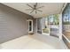 Covered back porch features ceiling fan, outdoor lighting, and access to the backyard at 2215 Montebell View Dr, Fuquay Varina, NC 27526