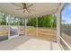 Screened-in porch with ceiling fan offers stunning views of the sprawling backyard at 2215 Montebell View Dr, Fuquay Varina, NC 27526