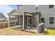 A comfortable screened porch featuring string lights offers relaxation and backyard views at 2215 Montebell View Dr, Fuquay Varina, NC 27526