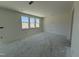 Spacious living room boasts large windows, offering ample natural light and a welcoming atmosphere at 2410 Abbot Hall Dr, Raleigh, NC 27616