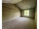 Bedroom featuring unfinished floor and natural light at 249 Finley Ct, Clayton, NC 27520