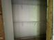 View of unfinished walk-in closet with wire shelving, ready to be customized at 249 Finley Ct, Clayton, NC 27520
