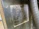 Close up of the HVAC label showing the model number and electrical ratings at 249 Finley Ct, Clayton, NC 27520