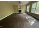 Empty living room featuring a fireplace and bright windows with backyard views at 249 Finley Ct, Clayton, NC 27520