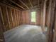 Interior view of a room under construction, showing stud framing and a window at 249 Finley Ct, Clayton, NC 27520
