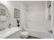 Clean bathroom featuring a shower-tub combo and white vanity at 2611 Sawmill Rd, Raleigh, NC 27613