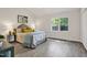 Spacious bedroom with a large window offering abundant natural light at 2611 Sawmill Rd, Raleigh, NC 27613