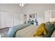 Bedroom featuring neutral-toned walls, blue accents, and closet at 2611 Sawmill Rd, Raleigh, NC 27613