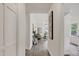 Bright, airy entry featuring vinyl floors and white walls that leads to the living area at 2611 Sawmill Rd, Raleigh, NC 27613