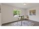 Bright home office featuring large window with a view and decorative rug at 2611 Sawmill Rd, Raleigh, NC 27613