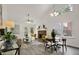 Spacious living area with vaulted ceilings, natural light, and a seamless flow to dining space at 2611 Sawmill Rd, Raleigh, NC 27613