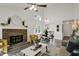 Bright living room featuring a brick fireplace and plenty of space for relaxation and entertainment at 2611 Sawmill Rd, Raleigh, NC 27613