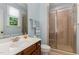 Bathroom featuring a glass shower, sink and vanity, toilet and window offering great natural light at 2821 Penfold Ln, Wake Forest, NC 27587