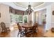 Formal dining room featuring a chandelier and bay window with natural light at 2821 Penfold Ln, Wake Forest, NC 27587