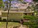 Back of a two-story home featuring a deck, patio, and landscaped backyard at 2821 Penfold Ln, Wake Forest, NC 27587