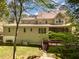 Back of a two-story home featuring a deck, patio, and landscaped backyard at 2821 Penfold Ln, Wake Forest, NC 27587