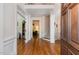 Welcoming foyer with hardwood floors, staircase, and views into adjacent rooms at 2821 Penfold Ln, Wake Forest, NC 27587