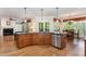 Kitchen with island sink and stainless steel appliances, open to living spaces at 2821 Penfold Ln, Wake Forest, NC 27587