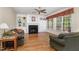 Spacious living room with fireplace, built-in shelves, and large windows at 2821 Penfold Ln, Wake Forest, NC 27587