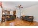 Open-concept living room featuring hardwood floors and comfortable seating at 2821 Penfold Ln, Wake Forest, NC 27587